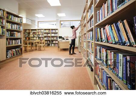 "Woman looking for a book in a school library, Reith im Alpbachtal, Tyrol, Austria, Europe" View Large Photo Image Stock Photography - "Woman looking for a book in a school library, Reith im Alpbachtal, Tyrol, Austria, Europe". Fotosearch