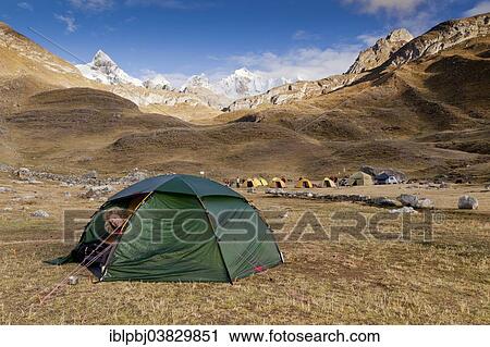 "Woman looking out of a tent, Cordillera Huayhuash, Peru, South America" View Large Photo Image Stock Image - "Woman looking out of a tent, Cordillera Huayhuash, Peru, South America". Fotosearch