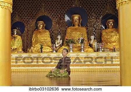 "Woman meditating in front of Buddha statues, Shwedagon Pagoda, Yangon, Yangon Region, Myanmar, Burma, Asia" View Large Photo Image Stock Photograph - "Woman meditating in front of Buddha statues, Shwedagon Pagoda, Yangon, Yangon Region, Myanmar, Burma, Asia". Fotosearch