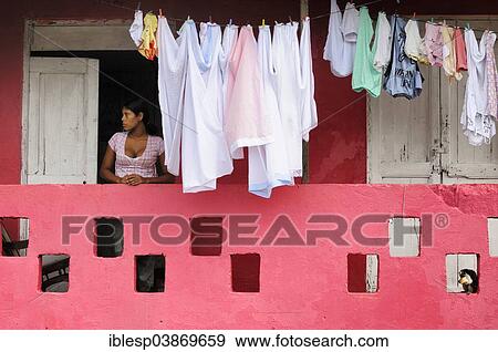 Stock Photo - "Woman next to washing on the line, Portobelo, Panama, North America". Fotosearch