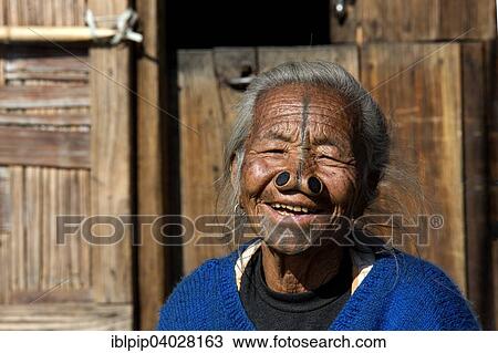 Stock Image - "Woman of the Apatani people, with nose plugs, Hapoli, Arunachal Pradesh, India, Asia". Fotosearch