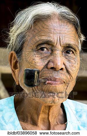 "Woman of the Chin people, ethnic minority, with a traditional facial tattoo smoking a pipe, the last of their kind, portrait, Rakhine State, Myanmar, Asia" View Large Photo Image Stock Photo - "Woman of the Chin people, ethnic minority, with a traditional facial tattoo smoking a pipe, the last of their kind, portrait, Rakhine State, Myanmar, Asia". Fotosearch