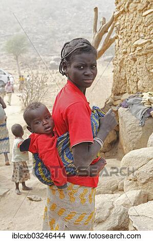 "Woman of the Mafa ethnic group carrying a baby on her back, near Tourou, Far North, Cameroon, Africa" View Large Photo Image Picture - "Woman of the Mafa ethnic group carrying a baby on her back, near Tourou, Far North, Cameroon, Africa". Fotosearch
