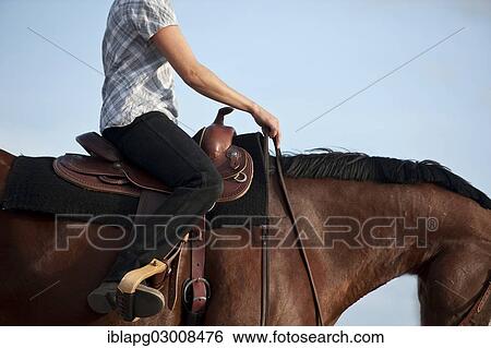 Stock Photograph - "Woman on a Quarter Horse, western-style riding, Germany, Europe". Fotosearch