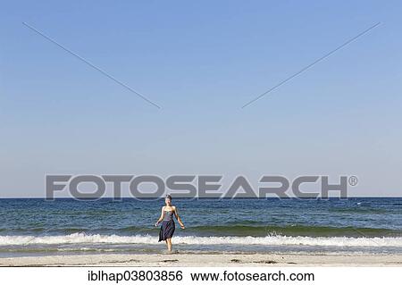 "Woman on the beach, Baltic Sea resort of Ahrenshoop, Fischland-Darss-Zingst, Bodden Landscape of Vorpommern National Park, Mecklenburg-Western Pomerania, Germany, Europe" View Large Photo Image Stock Photograph - "Woman on the beach, Baltic Sea resort of Ahrenshoop, Fischland-Darss-Zingst, Bodden Landscape of Vorpommern National Park, Mecklenburg-Western Pomerania, Germany, Europe". Fotosearch