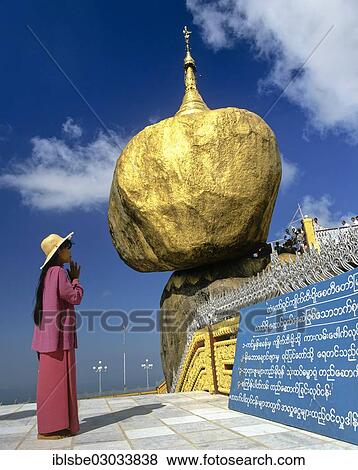 "Woman praying in front of the Golden Rock or Kyaiktiyo Pagoda, Kyaikto, Mon-Staat, Myanmar, Burma, Asia" View Large Photo Image Stock Photo - "Woman praying in front of the Golden Rock or Kyaiktiyo Pagoda, Kyaikto, Mon-Staat, Myanmar, Burma, Asia". Fotosearch