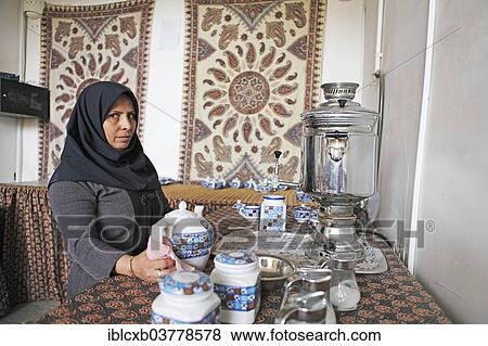 "Woman preparing Iranian tea, Yazd, Yazd Province, Persia, Iran, Asia" View Large Photo Image Stock Photo - "Woman preparing Iranian tea, Yazd, Yazd Province, Persia, Iran, Asia". Fotosearch