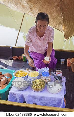 "Woman preparing Thai dessert with ice cream, at the Ayutthaya floating market in Thailand, Asia" View Large Photo Image Stock Photography - "Woman preparing Thai dessert with ice cream, at the Ayutthaya floating market in Thailand, Asia". Fotosearch