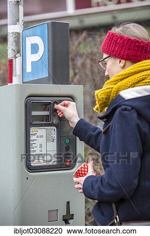 "Woman purchasing a parking ticket from a parking ticket vending machine, inner-city public parking, Essen, North Rhine-Westphalia, Germany, Europe" View Large Photo Image Stock Image - "Woman purchasing a parking ticket from a parking ticket vending machine, inner-city public parking, Essen, North Rhine-Westphalia, Germany, Europe". Fotosearch