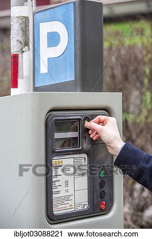 "Woman purchasing a parking ticket from a parking ticket vending machine, inner-city public parking, Essen, North Rhine-Westphalia, Germany, Europe" View Large Photo Image Stock Image - "Woman purchasing a parking ticket from a parking ticket vending machine, inner-city public parking, Essen, North Rhine-Westphalia, Germany, Europe". Fotosearch
