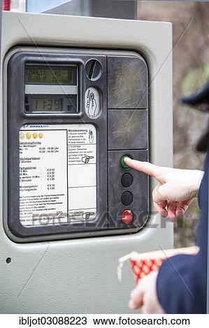 "Woman purchasing a parking ticket from a parking ticket vending machine, inner-city public parking, Essen, North Rhine-Westphalia, Germany, Europe" View Large Photo Image Stock Image - "Woman purchasing a parking ticket from a parking ticket vending machine, inner-city public parking, Essen, North Rhine-Westphalia, Germany, Europe". Fotosearch