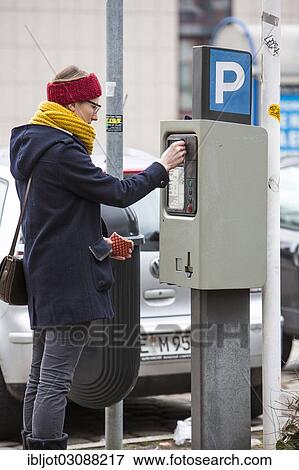 "Woman purchasing a parking ticket from a parking ticket vending machine, inner-city public parking, Essen, North Rhine-Westphalia, Germany, Europe" View Large Photo Image Stock Photo - "Woman purchasing a parking ticket from a parking ticket vending machine, inner-city public parking, Essen, North Rhine-Westphalia, Germany, Europe". Fotosearch