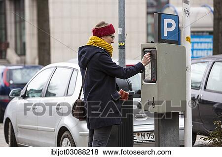 "Woman purchasing a parking ticket from a parking ticket vending machine, inner-city public parking, Essen, North Rhine-Westphalia, Germany, Europe" View Large Photo Image Stock Photo - "Woman purchasing a parking ticket from a parking ticket vending machine, inner-city public parking, Essen, North Rhine-Westphalia, Germany, Europe". Fotosearch