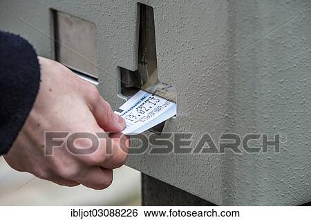 "Woman purchasing a parking ticket from a parking ticket vending machine, inner-city public parking, Essen, North Rhine-Westphalia, Germany, Europe" View Large Photo Image Stock Photograph - "Woman purchasing a parking ticket from a parking ticket vending machine, inner-city public parking, Essen, North Rhine-Westphalia, Germany, Europe". Fotosearch