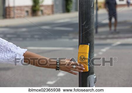 "Woman pushing a button for visually impaired people at a pedestrian crossing, Hesse, Germany, Europe" View Large Photo Image Stock Photo - "Woman pushing a button for visually impaired people at a pedestrian crossing, Hesse, Germany, Europe". Fotosearch