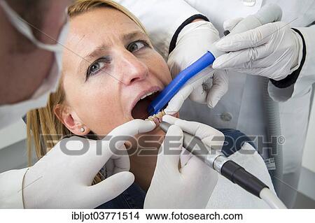 Picture - "Woman receiving treatment at the dentist, Germany, Europe". Fotosearch