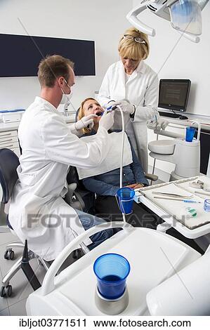 "Woman receiving treatment at the dentist, Germany, Europe" View Large Photo Image Stock Image - "Woman receiving treatment at the dentist, Germany, Europe". Fotosearch