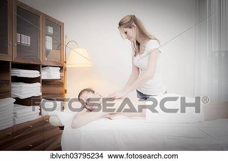 Woman relaxing with a massage View Large Photo Image Picture - Woman relaxing with a massage. Fotosearch