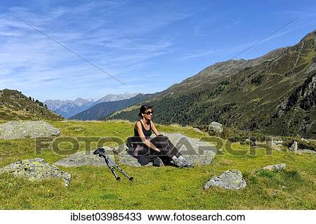 "Woman resting after a mountain hike, Fotschertal valley with view of the Nordkette range, Tyrol, Austria, Europe" View Large Photo Image Stock Image - "Woman resting after a mountain hike, Fotschertal valley with view of the Nordkette range, Tyrol, Austria, Europe". Fotosearch