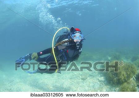 Stock Photography - "Woman scuba diving, Black Sea, Crimea, Ukraine, Europe". Fotosearch