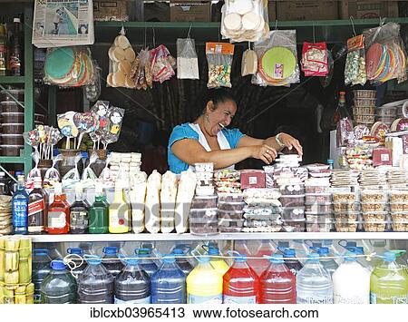 "Woman selling sweets and drinks made from sugar cane, Puyo, Pastaza Province, Ecuador, South America" View Large Photo Image Stock Image - "Woman selling sweets and drinks made from sugar cane, Puyo, Pastaza Province, Ecuador, South America". Fotosearch