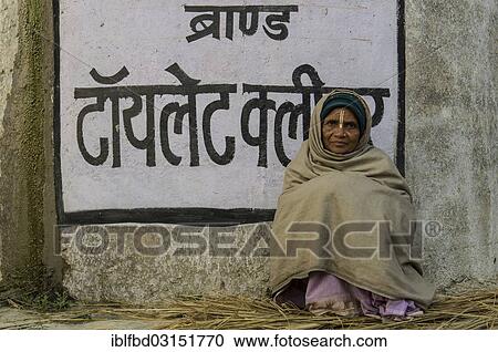 "Woman sitting at a wall with Hindi writing, during Kumbha Mela, Allahabad, Uttar Pradesh, India, Asia" View Large Photo Image Stock Image - "Woman sitting at a wall with Hindi writing, during Kumbha Mela, Allahabad, Uttar Pradesh, India, Asia". Fotosearch