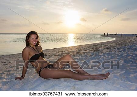 "Woman sitting on the beach, Male, North Male Atoll, Maldives, Asia" View Large Photo Image Stock Image - "Woman sitting on the beach, Male, North Male Atoll, Maldives, Asia". Fotosearch