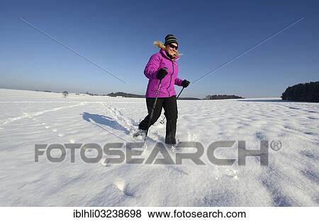 "Woman snowshoe walking, Munsing, Oberbayern, Bavaria, Germany, Europe" View Large Photo Image Stock Photo - "Woman snowshoe walking, Munsing, Oberbayern, Bavaria, Germany, Europe". Fotosearch