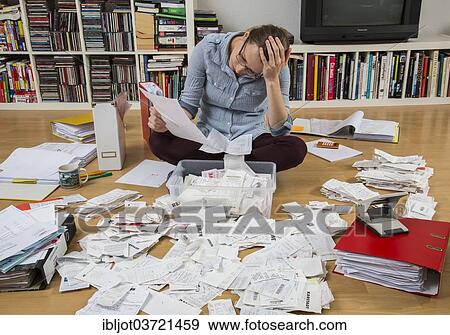 "Woman sorting documents, records, invoices and receipts on the ground, for the tax return" View Large Photo Image Stock Photo - "Woman sorting documents, records, invoices and receipts on the ground, for the tax return". Fotosearch