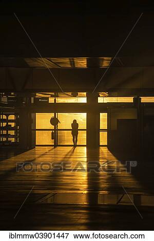 "Woman standing by a window watching the sunrise, atmospheric mood, Airport of Santa Cruz de La Palma, La Palma, Canary Islands, Spain, Europe" View Large Photo Image Stock Photo - "Woman standing by a window watching the sunrise, atmospheric mood, Airport of Santa Cruz de La Palma, La Palma, Canary Islands, Spain, Europe". Fotosearch