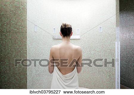 Woman standing in a steam room of a spa complex View Large Photo Image Stock Photo - Woman standing in a steam room of a spa complex. Fotosearch