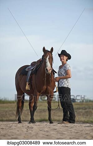 "Woman standing next to a Quarter Horse, Germany, Europe" View Large Photo Image Stock Photo - "Woman standing next to a Quarter Horse, Germany, Europe". Fotosearch