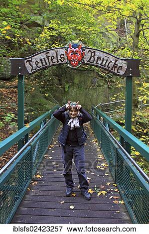 Woman standing on Teufelsbruecke, Devil's Bridge, trail from Treseburg to Thale, Bodetal, Harz National Park, Saxony-Anhalt, Germany, Europe View Large Photo Image Stock Photo - Woman standing on Teufelsbruecke, Devil's Bridge, trail from Treseburg to Thale, Bodetal, Harz National Park, Saxony-Anhalt, Germany, Europe. Fotosearch