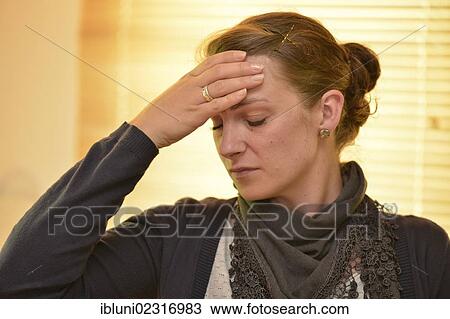 Woman suffering a headache View Large Photo Image Stock Image - Woman suffering a headache. Fotosearch