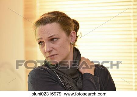 Stock Photo - Woman suffering neck pain. Fotosearch