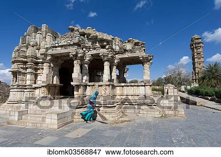 "Woman sweeping the stone slabs in front of temple ruins, Vijaya Stambha, a victory tower built during the reign of Rana Kumbha at the rear, Chittorgarh Fort, Chittorgarh, Rajasthan, India, Asia" View Large Photo Image Stock Photo - "Woman sweeping the stone slabs in front of temple ruins, Vijaya Stambha, a victory tower built during the reign of Rana Kumbha at the rear, Chittorgarh Fort, Chittorgarh, Rajasthan, India, Asia". Fotosearch