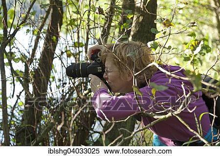 "Woman taking photos, Herthasee, Jasmund National Park, Rugen, Mecklenburg-Western Pomerania, Germany, Europe" View Large Photo Image Stock Photography - "Woman taking photos, Herthasee, Jasmund National Park, Rugen, Mecklenburg-Western Pomerania, Germany, Europe". Fotosearch