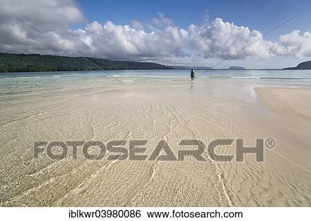 "Woman walking across a sandbank to the beach, Espiritu Santo, Vanuatu, Oceania" View Large Photo Image Stock Photograph - "Woman walking across a sandbank to the beach, Espiritu Santo, Vanuatu, Oceania". Fotosearch