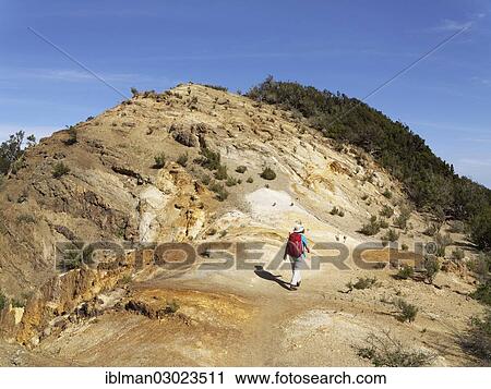 "Woman walking through eroded landscape, Cumbre de Chijere, Vallehermoso, La Gomera, Canary Islands, Spain, Europe" View Large Photo Image Stock Image - "Woman walking through eroded landscape, Cumbre de Chijere, Vallehermoso, La Gomera, Canary Islands, Spain, Europe". Fotosearch