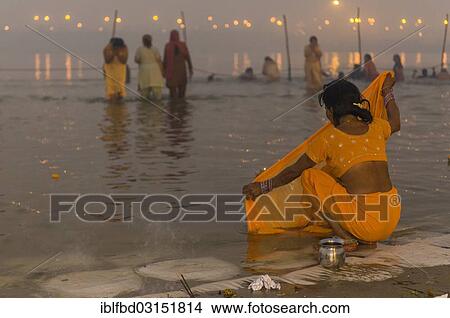 "Woman washing her sari in the Sangam, the confluence of the rivers Ganges, Yamuna and Saraswati, Kumbha Mela mass Hindu pilgrimage, Allahabad, Uttar Pradesh, India, Asia" View Large Photo Image Picture - "Woman washing her sari in the Sangam, the confluence of the rivers Ganges, Yamuna and Saraswati, Kumbha Mela mass Hindu pilgrimage, Allahabad, Uttar Pradesh, India, Asia". Fotosearch