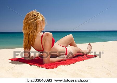 "Woman wearing a bikini, sunbathing on a sandy beach, Sotavento, Costa Bahia, Costa Calma, Fuerteventura, Canary Islands, Spain, Europe" View Large Photo Image Stock Image - "Woman wearing a bikini, sunbathing on a sandy beach, Sotavento, Costa Bahia, Costa Calma, Fuerteventura, Canary Islands, Spain, Europe". Fotosearch