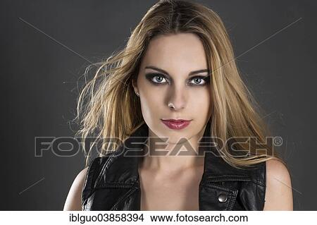 "Woman wearing a black leather waistcoat, portrait" View Large Photo Image Picture - "Woman wearing a black leather waistcoat, portrait". Fotosearch