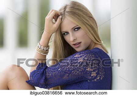 Woman wearing a blue crochet top View Large Photo Image Stock Photograph - Woman wearing a blue crochet top. Fotosearch
