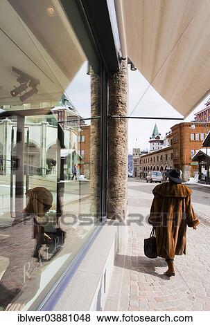 Stock Photo - "Woman wearing a fur coat, Ralph Lauren boutique, Badrutt's Palace Hotel, St. Moritz, Engadin, Graubunden, Switzerland, Europe". Fotosearch