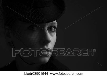 "Woman wearing a hat, portrait" View Large Photo Image Picture - "Woman wearing a hat, portrait". Fotosearch