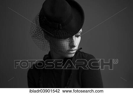 Stock Image - "Woman wearing a hat, portrait". Fotosearch