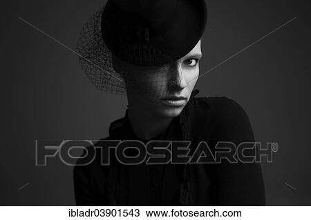 "Woman wearing a hat, portrait" View Large Photo Image Stock Image - "Woman wearing a hat, portrait". Fotosearch