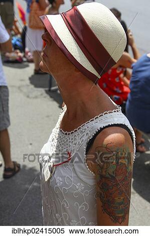 Woman wearing a Panama hat and a summer dress, tattoo, retro look View Large Photo Image Stock Photography - Woman wearing a Panama hat and a summer dress, tattoo, retro look. Fotosearch