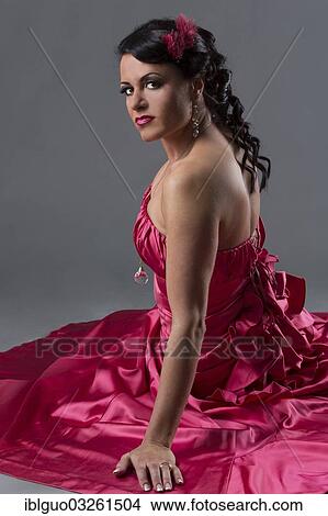 Woman wearing a pink dress View Large Photo Image Picture - Woman wearing a pink dress. Fotosearch