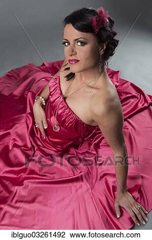 Woman wearing a pink dress View Large Photo Image Stock Image - Woman wearing a pink dress. Fotosearch